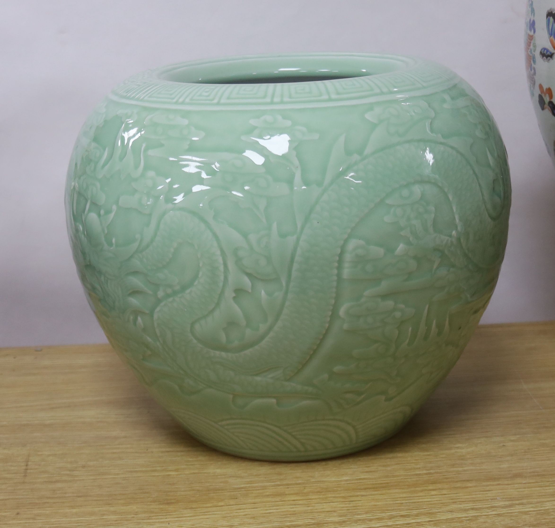 A large Chinese celadon glazed 'dragon' jardiniere or fish bowl 29cm